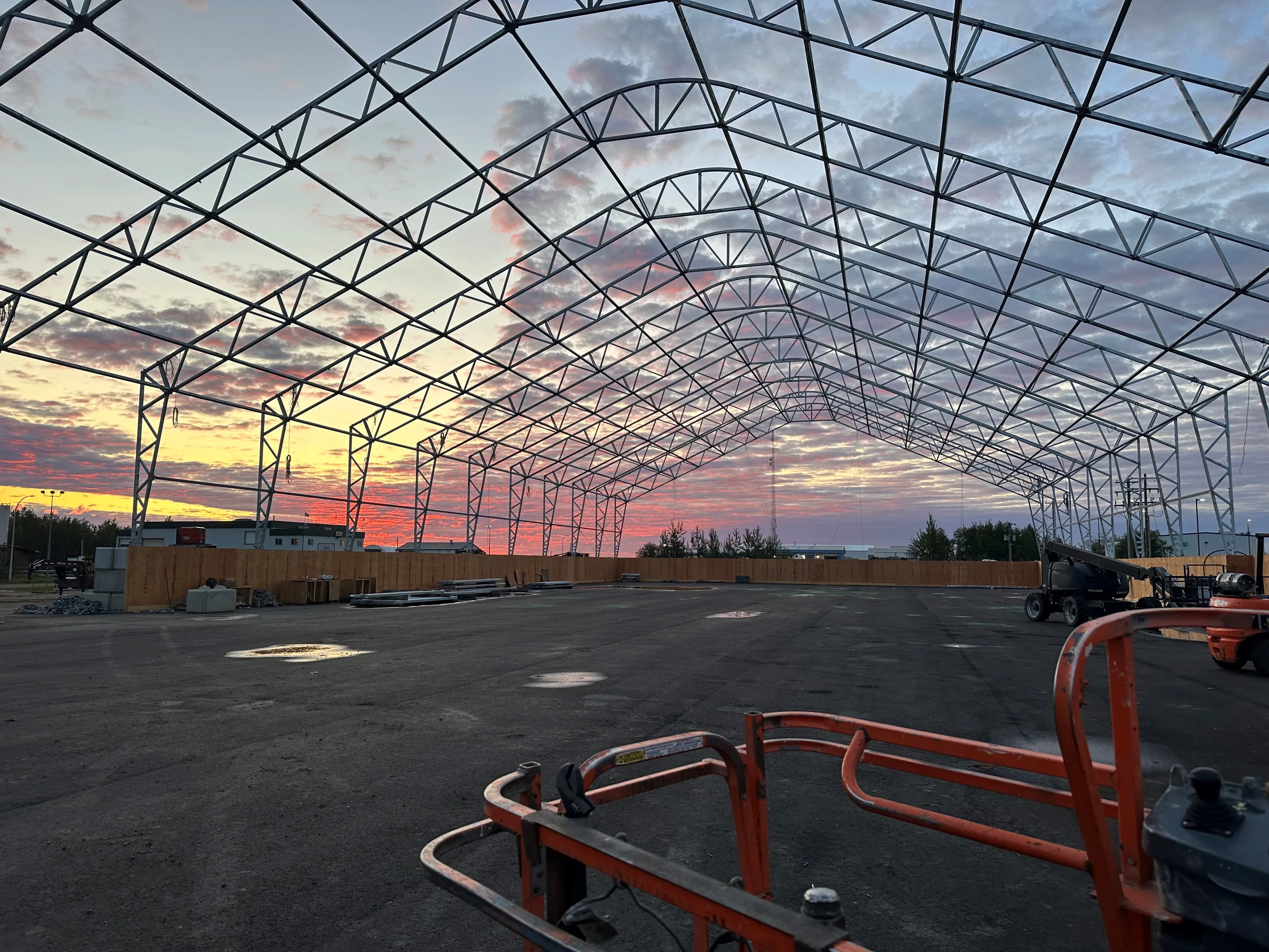 CENTURION 36 — clear-span steel truss frame at sunset